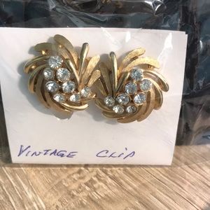 Clip on gold-tone earrings w/Clear rhinestones